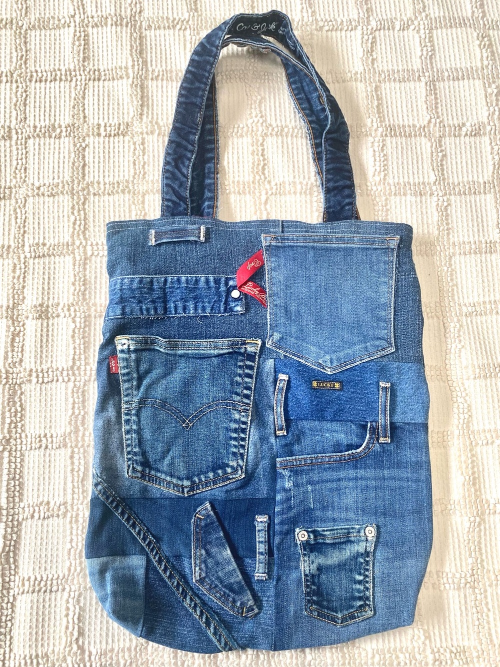 Handmade recycled jeans reworked patchwork denim pocket tote bag plaid lining